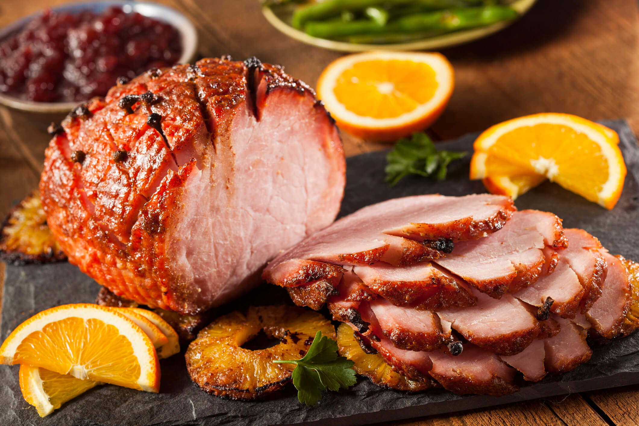 Photo of a ham with oranges